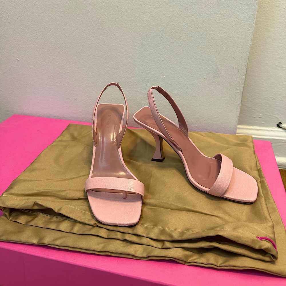 By Far light pink low hill sandals.